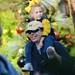 Michigan fan Cam Moore, of Tampa, smiles as he carries his four-year-old daughter Maddy on his shoulders as they watch members of the Michigan football teammate during a team outing at Busch Gardens in Tampa, Fla. on Saturday, Dec. 29. Melanie Maxwell I AnnArbor.com